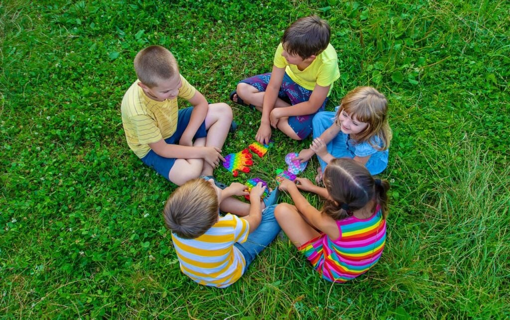 children-play-anti-stress-popit-on-the-street-sel-2023-11-27-05-27-04-utc-scaled (1) Large